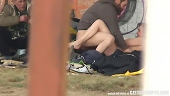 A Threesome Of Homeless Individuals Engaging In Sexual Activity In A Public Setting, Observed By A Voyeur