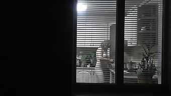 Neighborhood Watch: Voyeur Captures Naked Neighbor In Kitchen